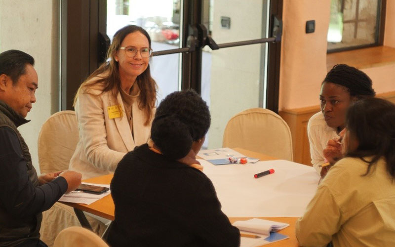 participants seated round a table in the ACDx course